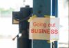 Fast-Food Pay Hike Backfires — CLOSED! Sign stating 'Going out of Business' attached to a pole