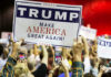 MAGA Pastor’s Phone Ends His Political Run People holding Trump Make America Great Again signs.