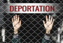 Razor-Thin Vote Supercharges THESE Deportations Hands reaching through a chain-link fence with the word 'DEPORTATION' above