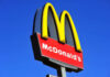McDonald’s War Zone Stuns Community McDonalds logo on a pole clear sky