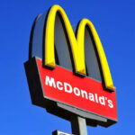 McDonalds logo on a pole clear sky