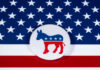 Dem Governor Slashes Sentence — Free Speech Bombshell Democratic Party donkey logo on American flag background.