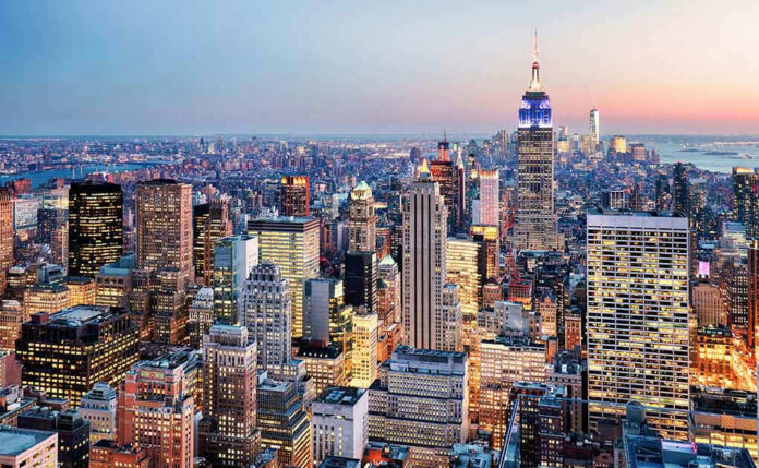 412523491 New York City skyline at dusk with skyscrapers.
