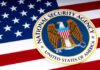 Spy Chief Shock: Wall Street Enforcer Tapped National Security Agency logo on American flag background.