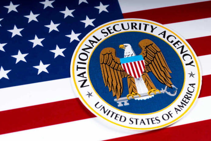 shutterstock_1054858052 National Security Agency logo on American flag background.