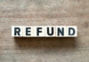 Deadly Risk Hiding In Cute Sandals Wooden blocks spelling the word 'REFUND' on a wooden surface