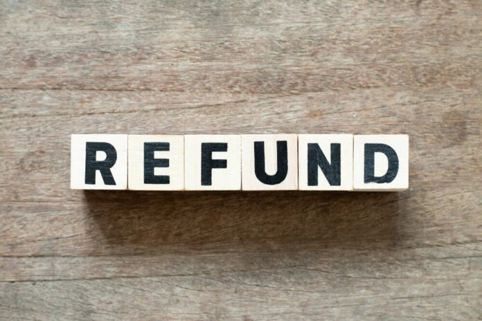 Letter,Block,In,Word,Refund,On,Wood,Background Wooden blocks spelling the word 'REFUND' on a wooden surface
