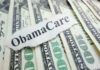 ObamaCare text over money background.