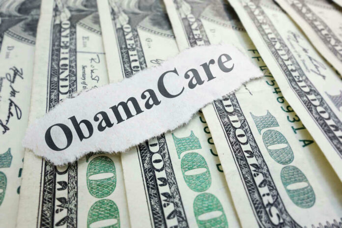 ObamaCare text over money background.