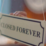 Pet Chain Gut-Punch: 75 Stores Axed Closed forever sign being placed on window.