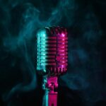 A vintage microphone surrounded by colorful smoke