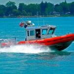 A U.S. Coast Guard boat speeding across the water