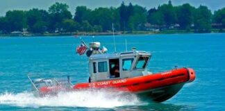 A U.S. Coast Guard boat speeding across the water