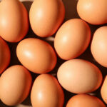 Egg Recall Panic Sweeps United States Brown eggs arranged closely together in bright light