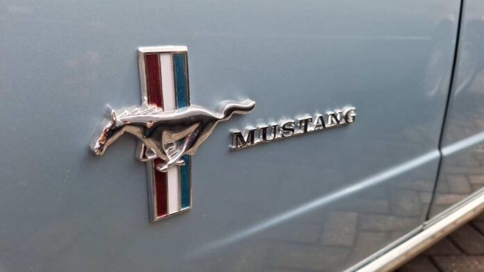 Surabaya,,Indonesia,-,January,12,,2025:,Close,Up,Photo,Of Ford Mustang emblem on a light blue car