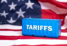 Smoke ‘Invasion’ Tariffs — Trump’s Wild Gambit Shipping container reading tariffs on the American flag