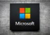 Microsoft logo displayed on a textured wall