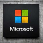 Microsoft logo displayed on a textured wall