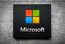 Microsoft logo displayed on a textured wall