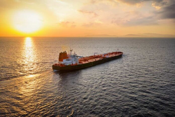 Aerial,View,Of,A,Heavy,Loaded,Crude,Oil,Tanker,Traveling Oil tanker sailing at sunset on open sea