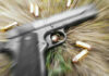 Three Shooters, One Dead — Questions Explode Pistol and bullets on grass with motion blur effect.
