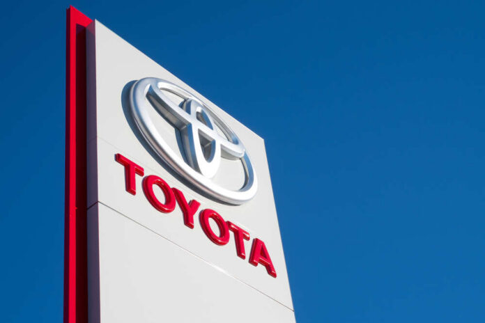 Cologne,,Germany,-,August,25,,2016:,Toyota,Dealership,Sign,Against