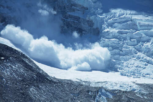Avalanche,In,Himalaya An avalanche cascading down a glacier in a mountainous region