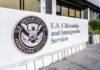 U.S. Citizenship and Immigration Services building sign.