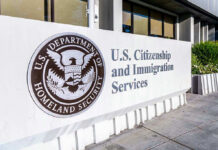 Visa Bloodbath Looms — 200,000 on the Line U.S. Citizenship and Immigration Services building sign.
