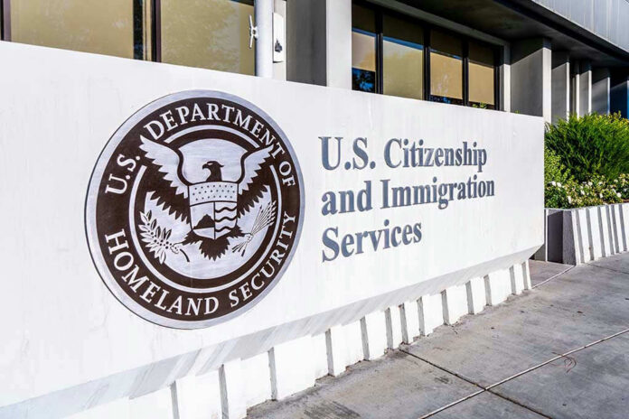 1590456970 U.S. Citizenship and Immigration Services building sign.