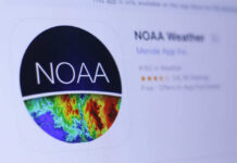 Hottest Month Ever — NOAA Drops Bomb Thermometer displaying high temperature against a bright sun