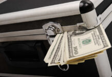 Carry-On Crackdown: Pay Or Squeeze Airplane interior with passengers seated mid-flight.