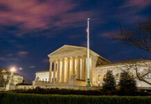 High Court Double-Down Angers Trump The United States Supreme Court building at dusk.