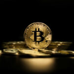 Trump Media Bleeds — Bitcoin Blunder? Gold Bitcoin coin on pile, dark background.