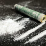 Initiation Twist: Pledges Cut Cocaine Cocaine lines with rolled banknote on surface