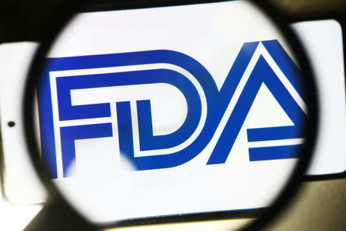 shutterstock_2274913075 FDA logo under magnifying glass