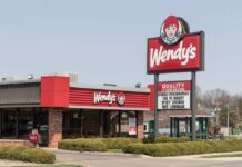 Wendy's fast-food restaurant exterior with large roadside sign