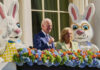 Joe and Jill Biden with Easter Bunny costumes and flower decoration.