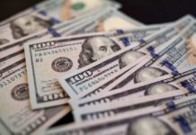 Housing Squeeze Forces Boomerang Boom Close-up of scattered hundred dollar bills