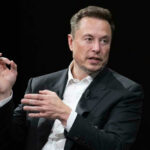 TODAY: Musk Honored By Ukraine Elon Musk in a suit talking.