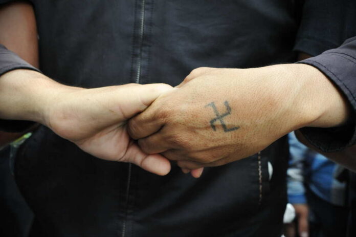 Bangkok,-,Aug,7:,Anti,Government,Protest,Guards,Link,Arms Nazi tattoo