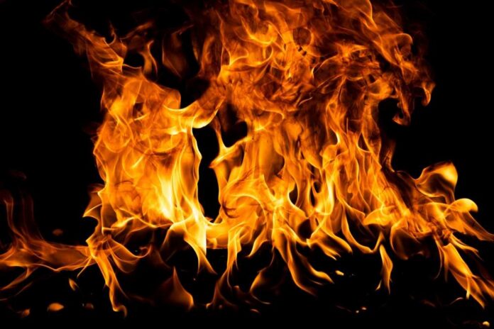 Blaze,Fire,Flame,Texture,For,Banner,Background. Bright flames dancing against a dark background