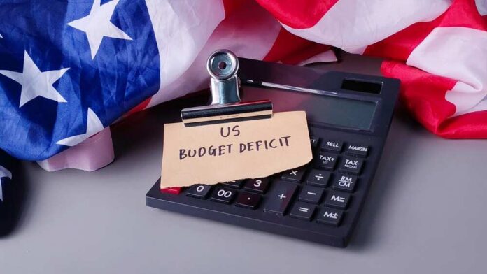 Us,Budget,Deficit,Note,On,Calculator,With,American,Flag:,National
