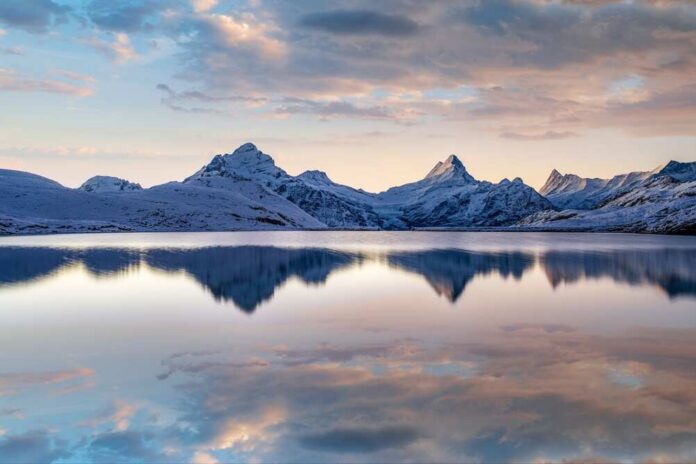 Lake,Bachalpsee,,Switzerland,With,Jungfrau,,Eiger,,Monch,And,Other,Peaks An avalanche cascading down a snowy mountain slope