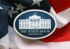 White House Shake-Up: Press Room Goes Quiet Press podium with the White House sign and an American flag in the background