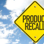 Border Blunder Yanks 15 Tons Of Beef Yellow product recall sign against cloudy sky