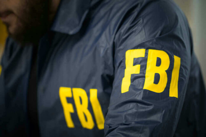 shutterstock_622639673 FBI agent in navy blue jacket.
