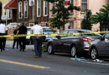 Sopranos Icon Found After Eerie Silence Police and crime scene tape on city street.