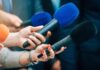 Recall Fiasco Hits Popular Pickup Truck Reporters holding colorful microphones