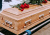 Showbiz Icon Gone – Hollywood Stunned Wooden casket with red roses on top